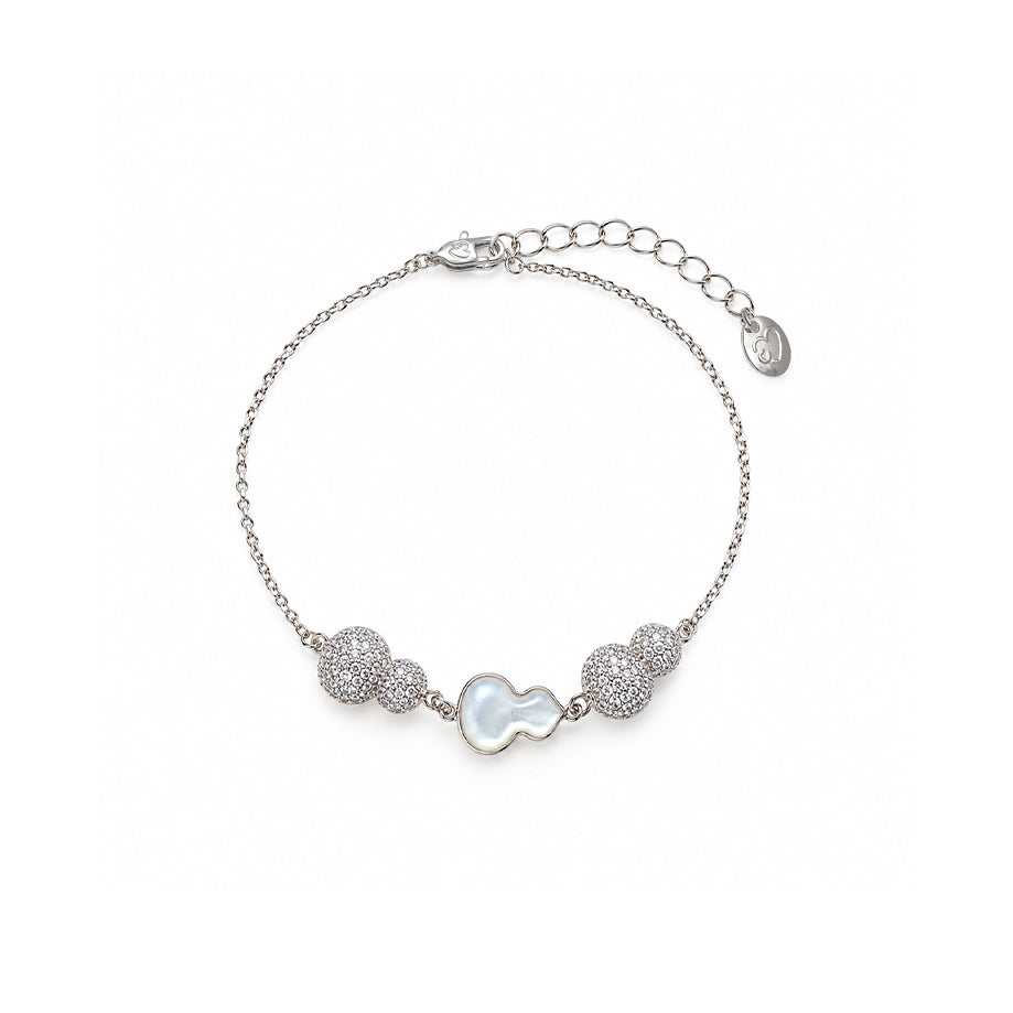 cz bracelet with a fine silver-tone chain, white iridescent gourd charm and sparkling pavé bead accents.