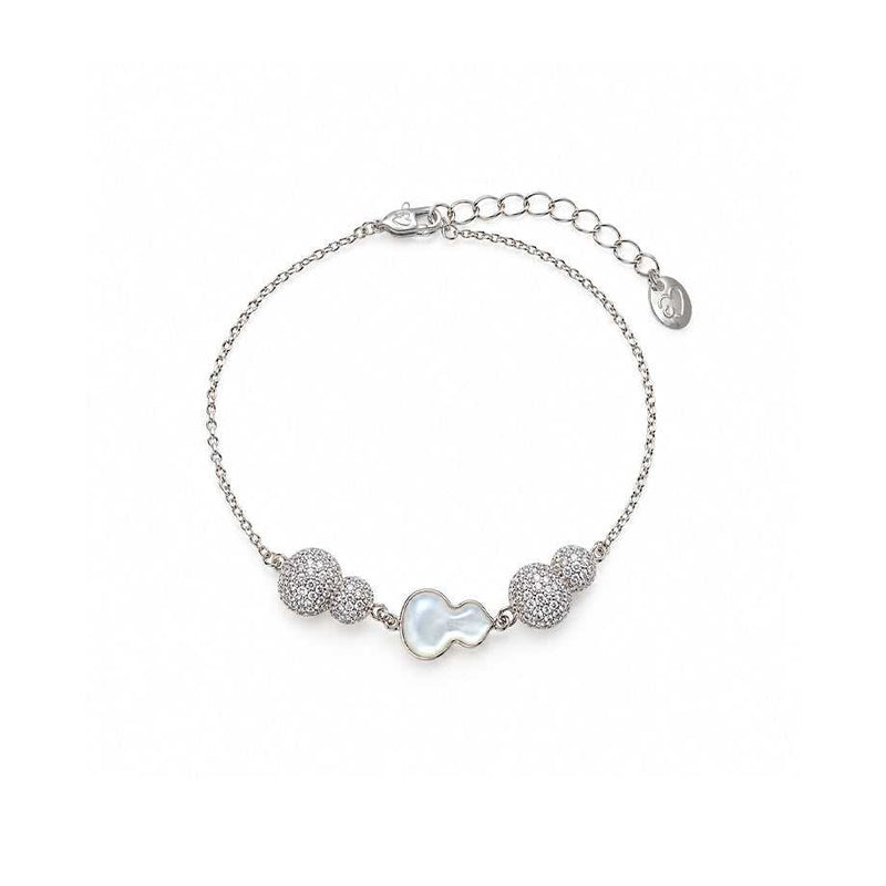 cz bracelet with a fine silver-tone chain, white iridescent gourd charm and sparkling pavé bead accents.