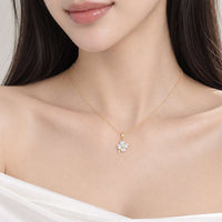 Gold-tone chain necklace with a small clear-stone floral pendant; Butterfly Cubic Zirconia design with a delicate finish.