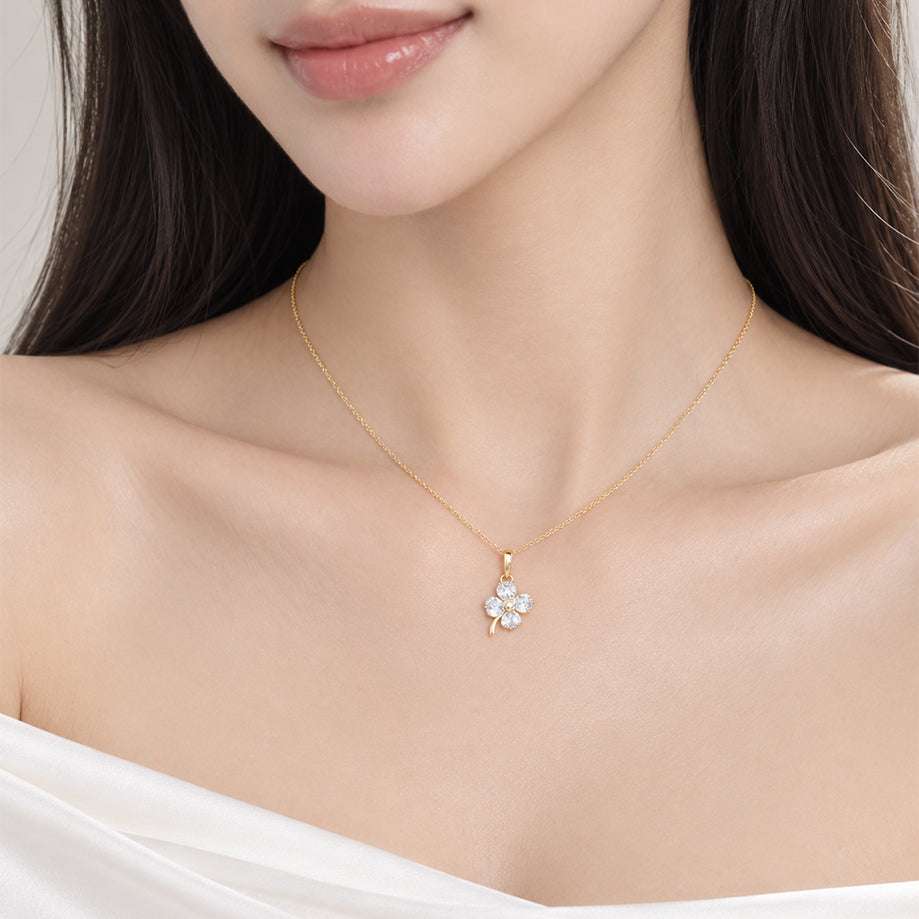 Gold-tone chain necklace with a small clear-stone floral pendant; Butterfly Cubic Zirconia design with a delicate finish.
