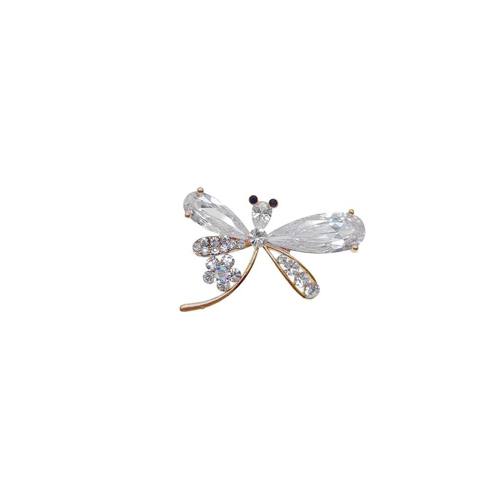 Gold plated dragonfly brooch with cubic zirconia and flower accent