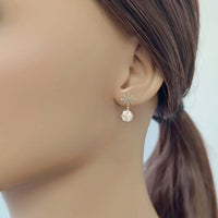 Gold plated starburst cubic zirconia clip-on earrings with faceted balls and 2.6cm drop