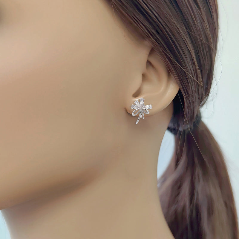 Cubic zirconia flower bouquet clip-on earrings with ribbon detailing and rhodium-plated finish