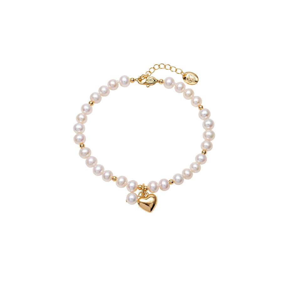 Freshwater Pearl Bracelet with lustrous white pearls, small gold beads, and a polished gold heart charm.