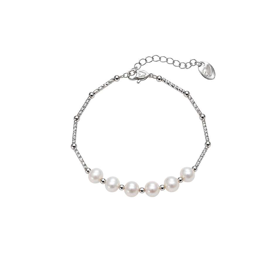 Freshwater Pearl Bracelet with seven white round pearls and a delicate silver-tone chain, finished with a spring clasp.
