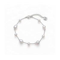 Freshwater Pearl Bracelet with lustrous white round and baroque pearls spaced along a delicate silver-tone chain with an adjustable clasp.