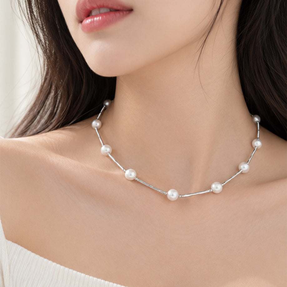 Freshwater Pearl Necklace with white round pearls linked by slender silver-tone wire in a delicate choker design.