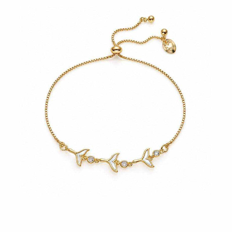 Gold bracelet with a fine chain, three mermaid tail charms and sparkling cubic zirconia accents, plus a sliding clasp