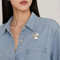 Gold plated mother of pearl and cubic zirconia clover brooch