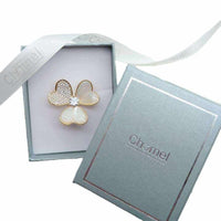 Gold plated 3 leaf clover mother of pearl brooch with cubic zirconia