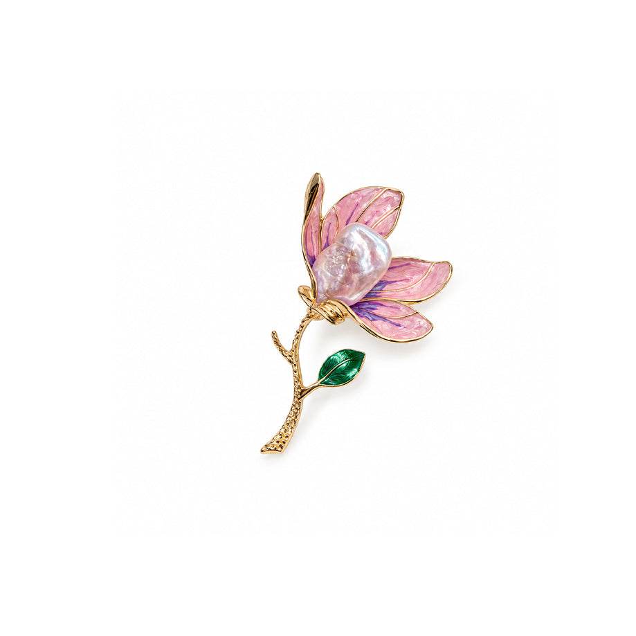Flower pearl brooch with pink and purple enamel petals, a gold-tone stem and green leaf, and a lustrous pearl.
