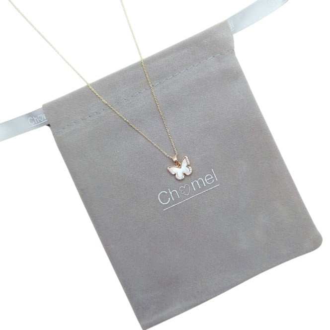 Butterfly pendant necklace with a gold-tone chain, white pearlescent centre and sparkling crystal border