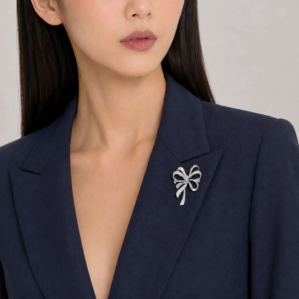 Ribbon cubic zirconia brooch with rhodium plating and pin clasp