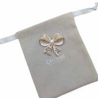 Gold plated ribbon brooch with 7mm freshwater pearl and cubic zirconia