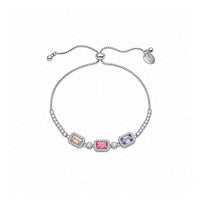Slider bracelet in silver-tone metal with three colourful rectangular stones, bordered and flanked by small clear crystals and an adjustable chain.