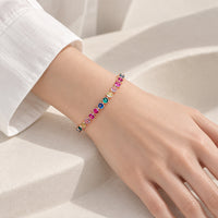 Cubic Zirconia Tennis Bracelet with vibrant 4mm colorful stones framed in a rosegold plated setting on wrist