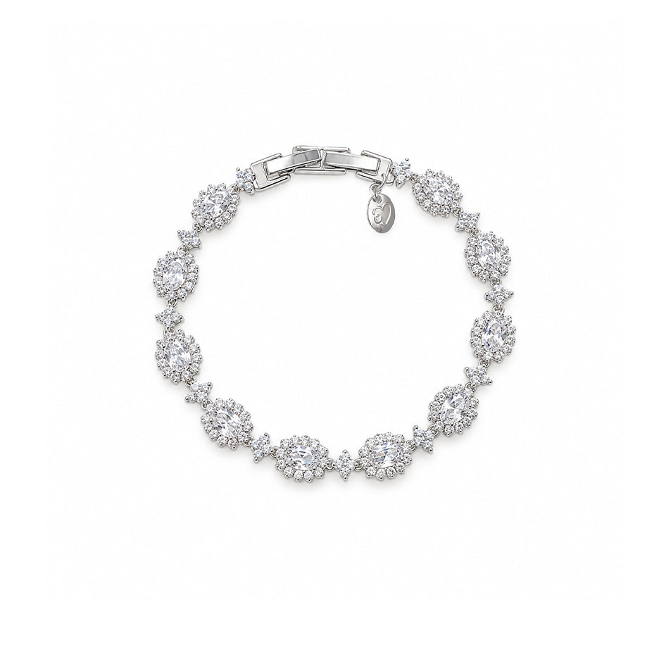 Cubic Zirconia Tennis Bracelet with rhodium plated finish featuring oval brilliant stones surrounded by small stones in a delicate design.