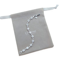 Cubic Zirconia Tennis Bracelet featuring oval brilliant stones surrounded by smaller stones with a rhodium plated finish on a silver-tone chain