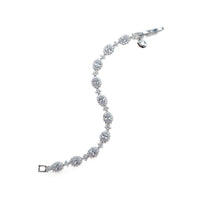 Cubic Zirconia Tennis Bracelet with rhodium plated silver finish, oval brilliant stones bordered by smaller stones in a linked design