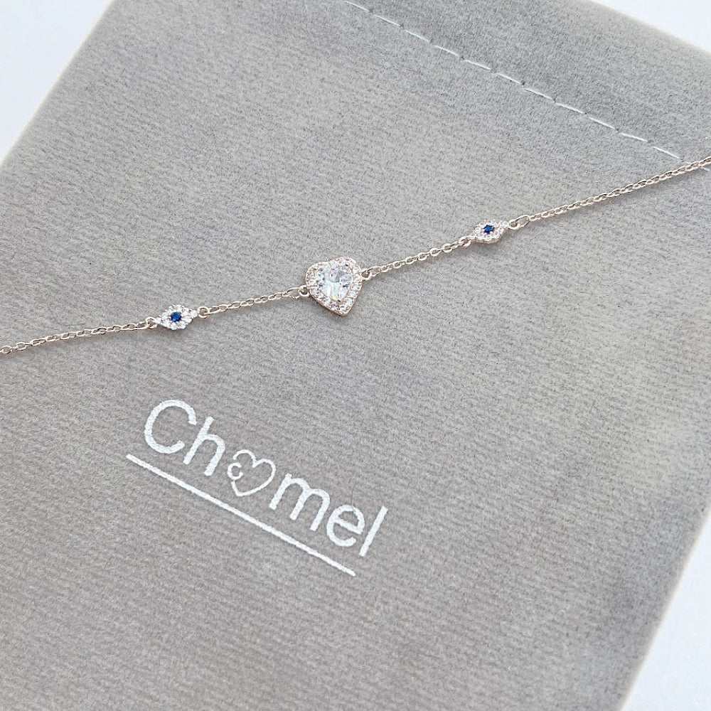 Rosegold plated heart cubic zirconia bracelet with evil eye charms on adjustable chain
