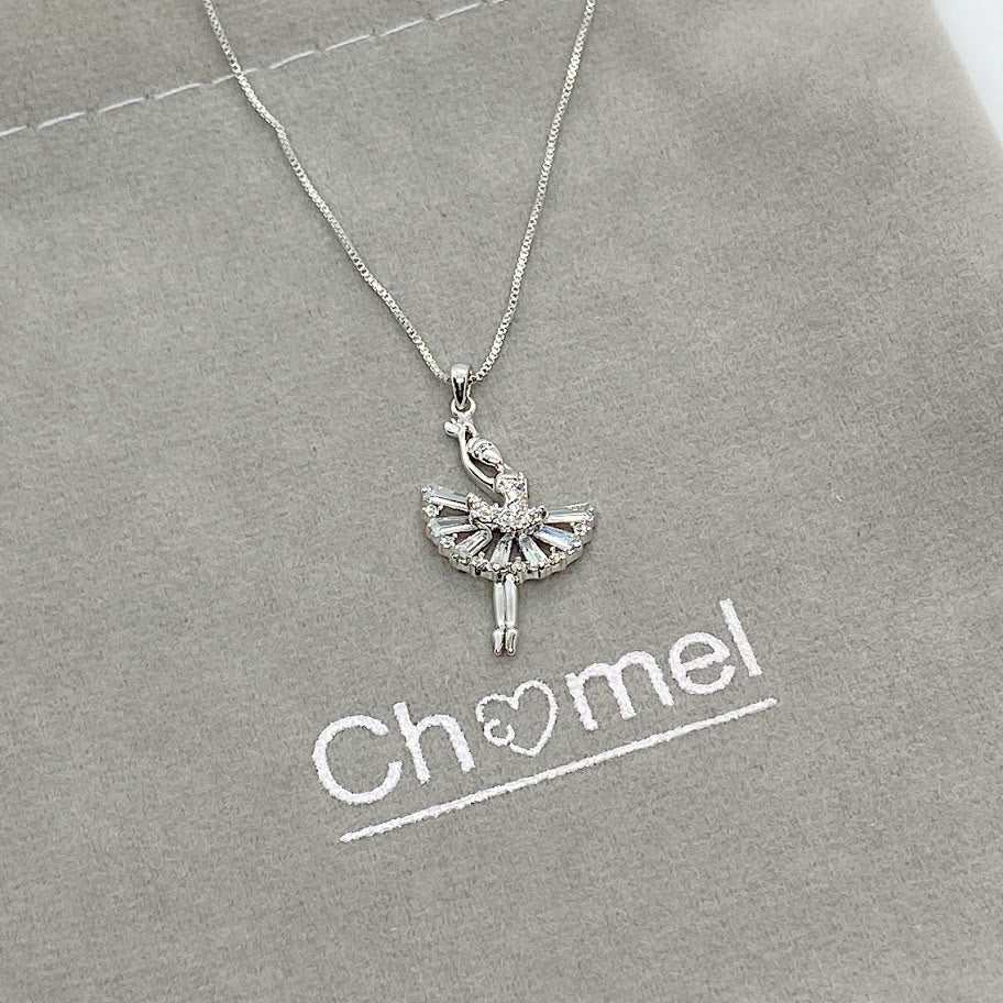 Ballerina cubic zirconia pendant necklace with rhodium plating and adjustable chain on gray background