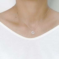 Ballerina cubic zirconia pendant necklace with rhodium plated finish on a woman's neck