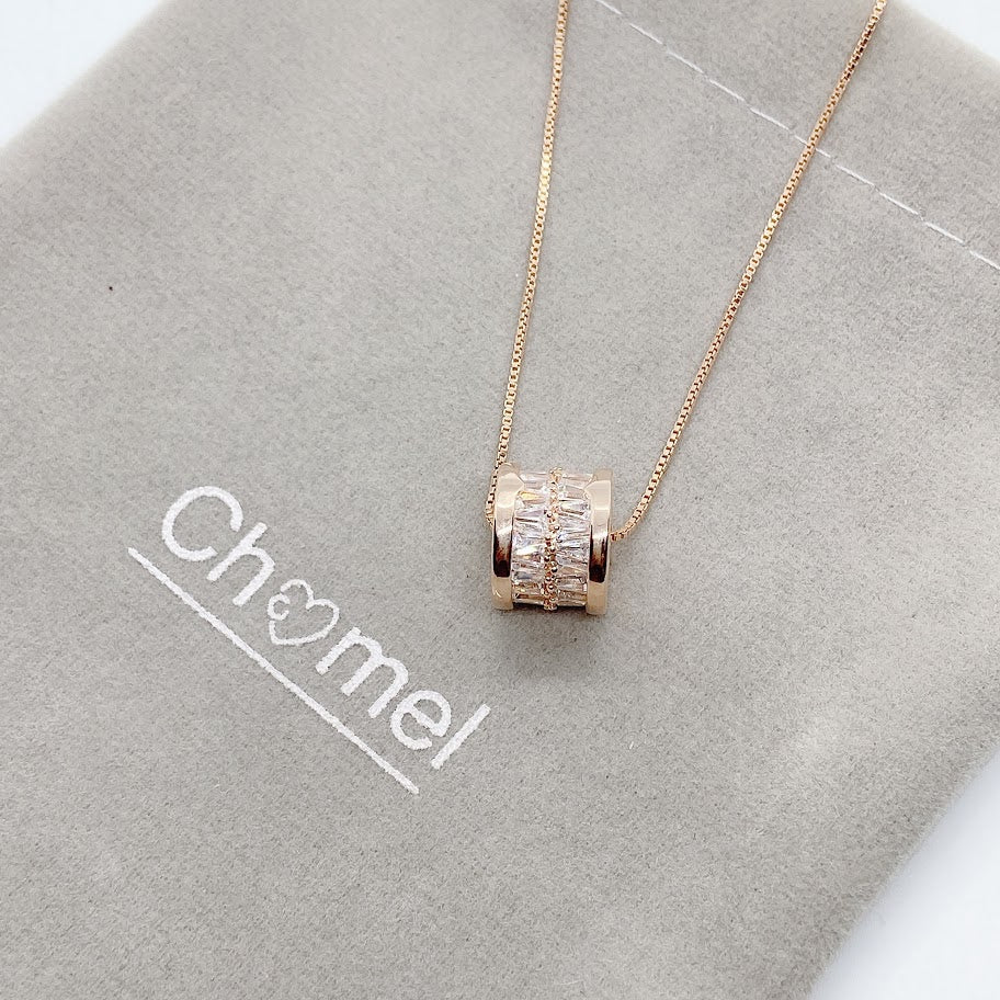 Rose gold tunnel cubic zirconia necklace pendant engraved with "LOVE" on chain with adjustable length