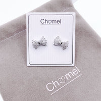 Ribbon cubic zirconia stud earrings with rhodium plated finish on branded card