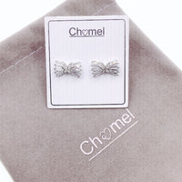 Ribbon cubic zirconia stud earrings with butterfly center on rhodium plated post backing displayed on branded card and fabric pouch