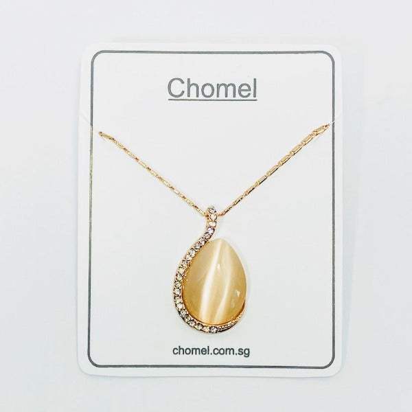 Simulated Moonstone Necklace with a gold-tone chain, oval cream teardrop pendant and sparkling crystal accents.