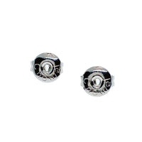 Ribbon cubic zirconia stud earrings with rhodium plated finish and post backings