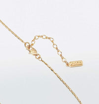Simulated Moonstone Necklace with a fine rose gold-toned chain, spring clasp and adjustable extender; pendant not visible.