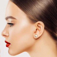 Woman wearing classic freshwater pearl button stud earrings